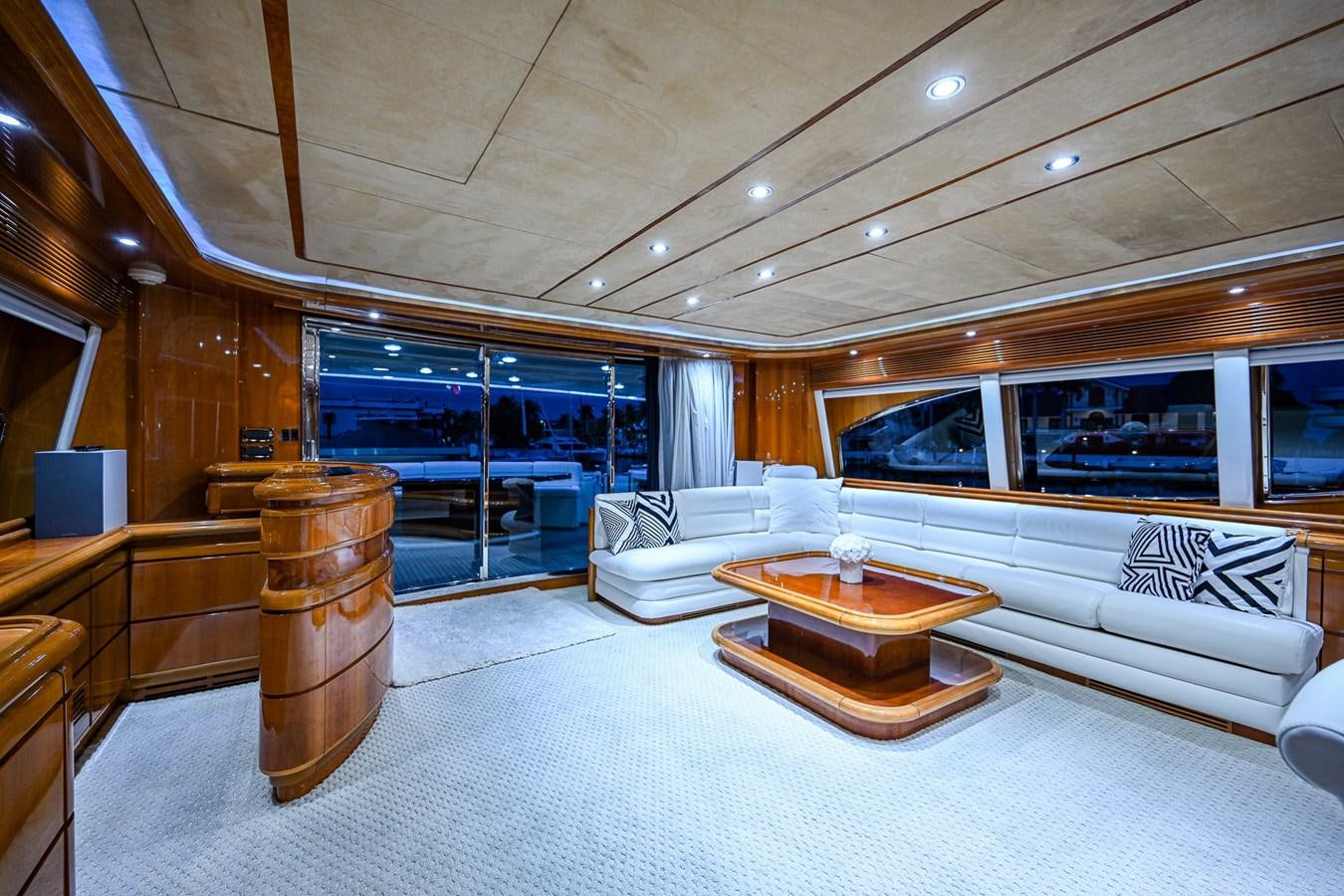 a large living room with a large glass window aboard EVERYTHING GOOD Yacht for Sale