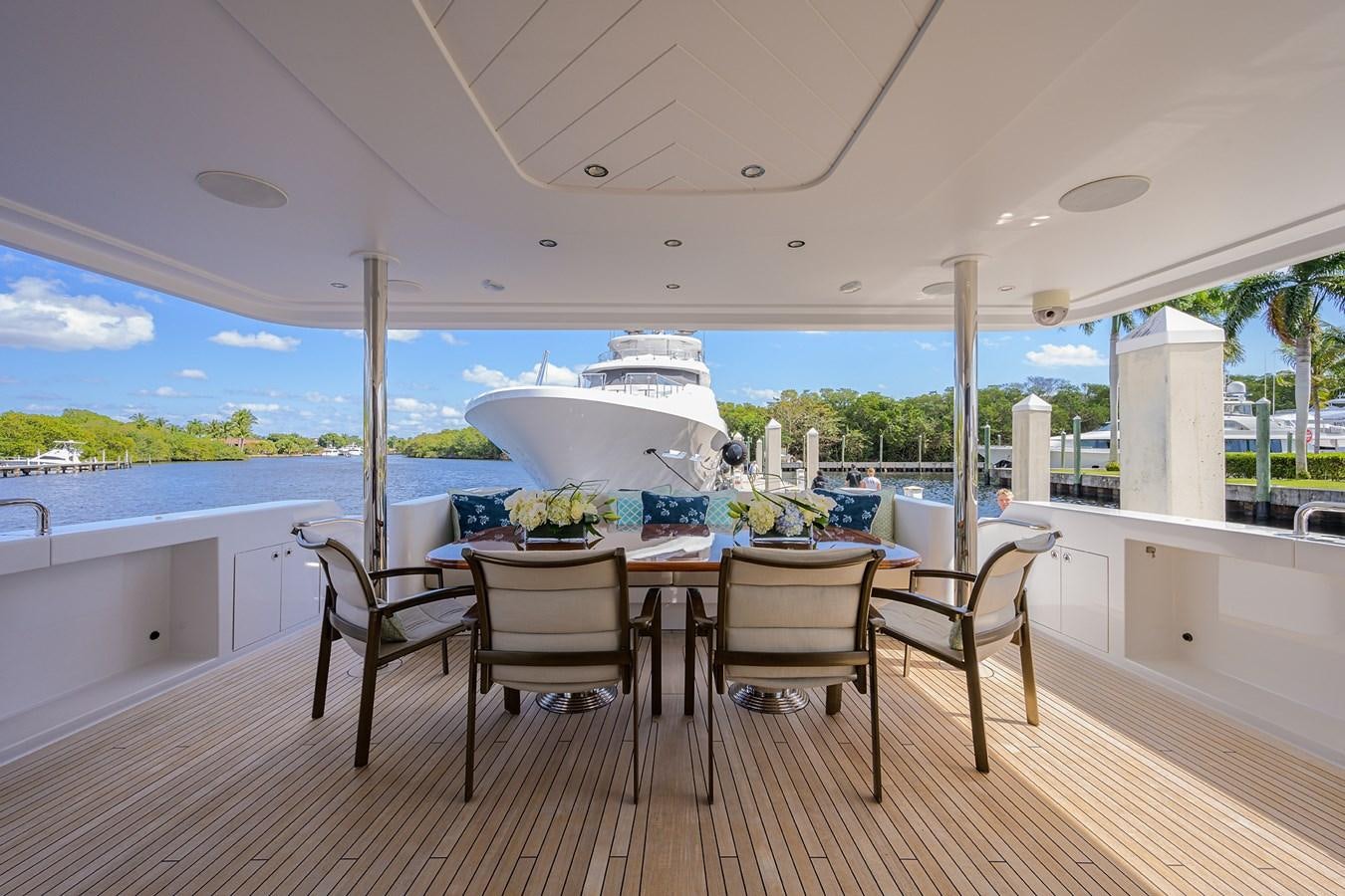 a table and chairs on a deck aboard TIRELESS Yacht for Sale