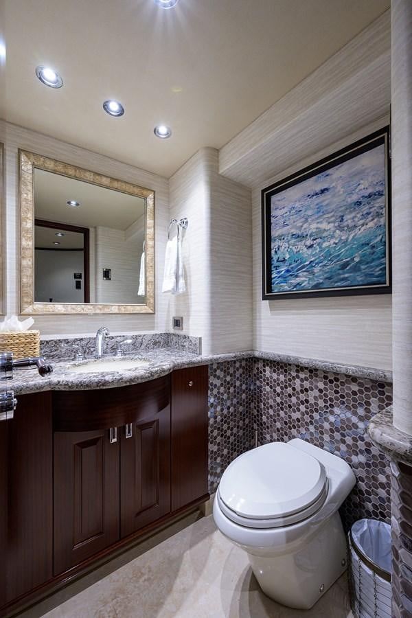 a bathroom with a toilet and a sink aboard TIRELESS Yacht for Sale