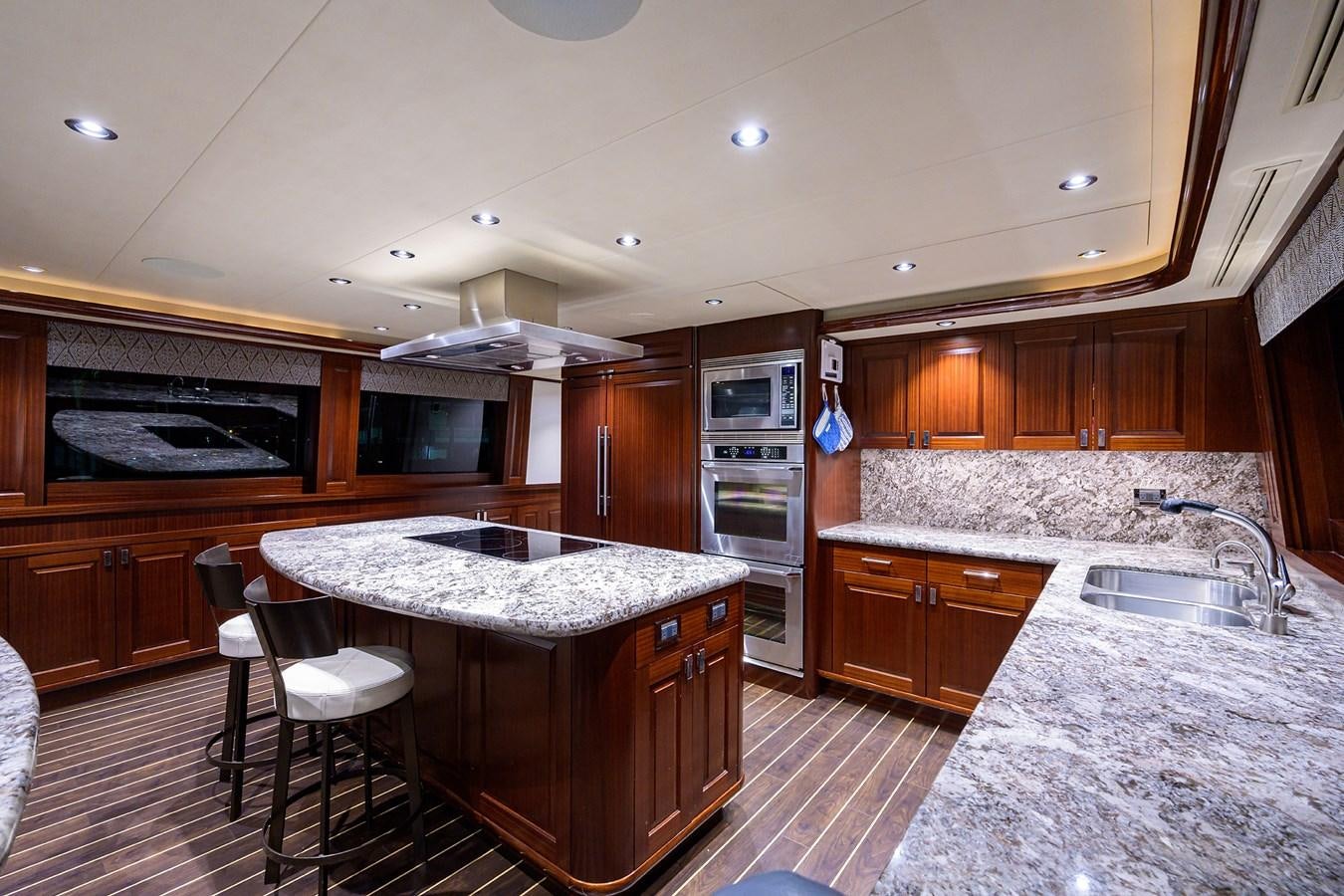 a kitchen with a large island aboard TIRELESS Yacht for Sale
