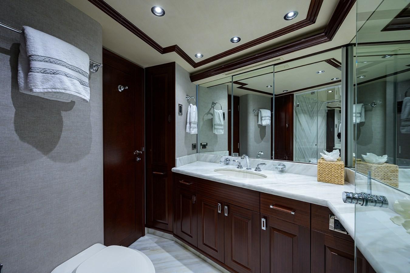a bathroom with a large mirror aboard TIRELESS Yacht for Sale