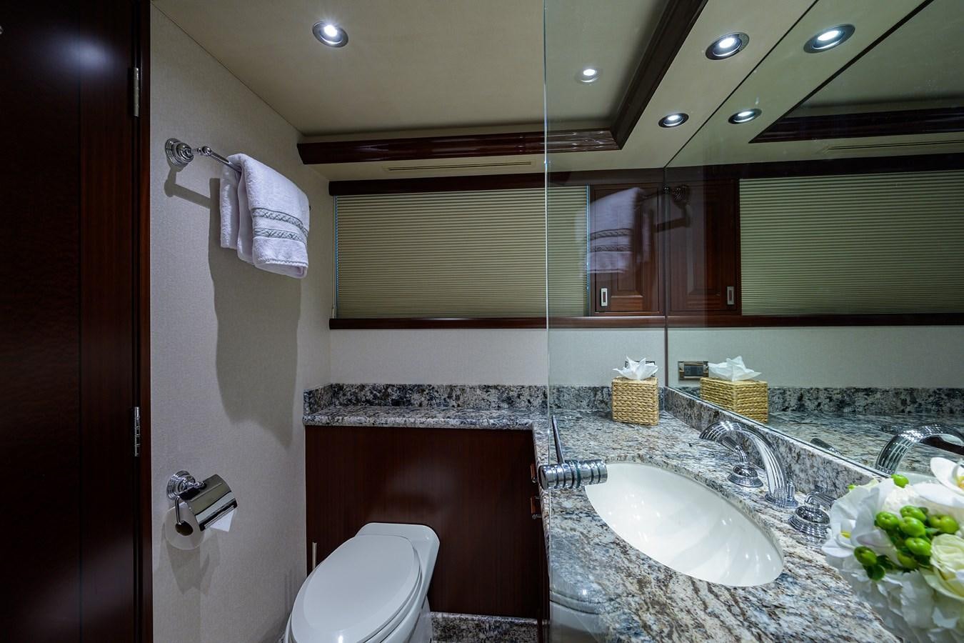 a bathroom with a sink and toilet aboard TIRELESS Yacht for Sale