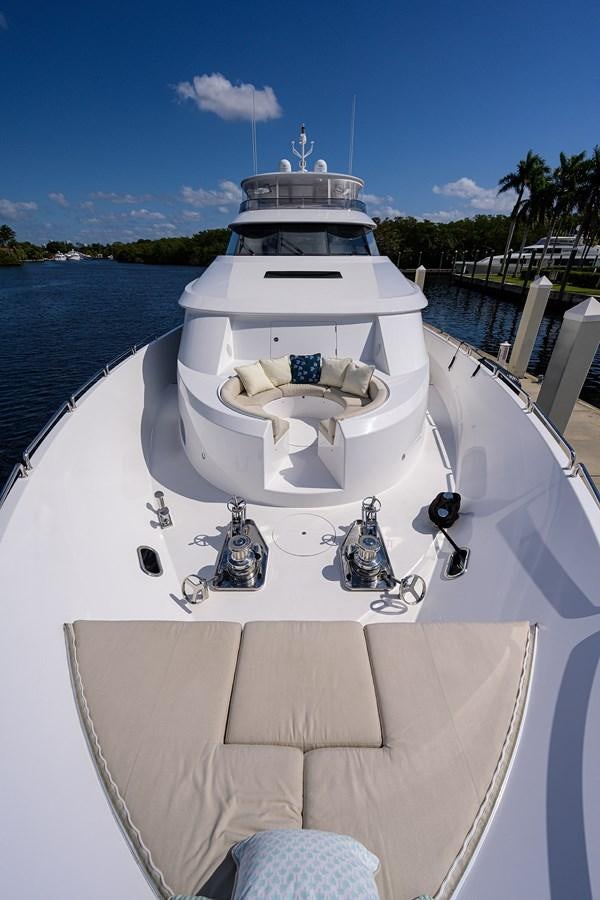 a white boat with a cross on it aboard TIRELESS Yacht for Sale