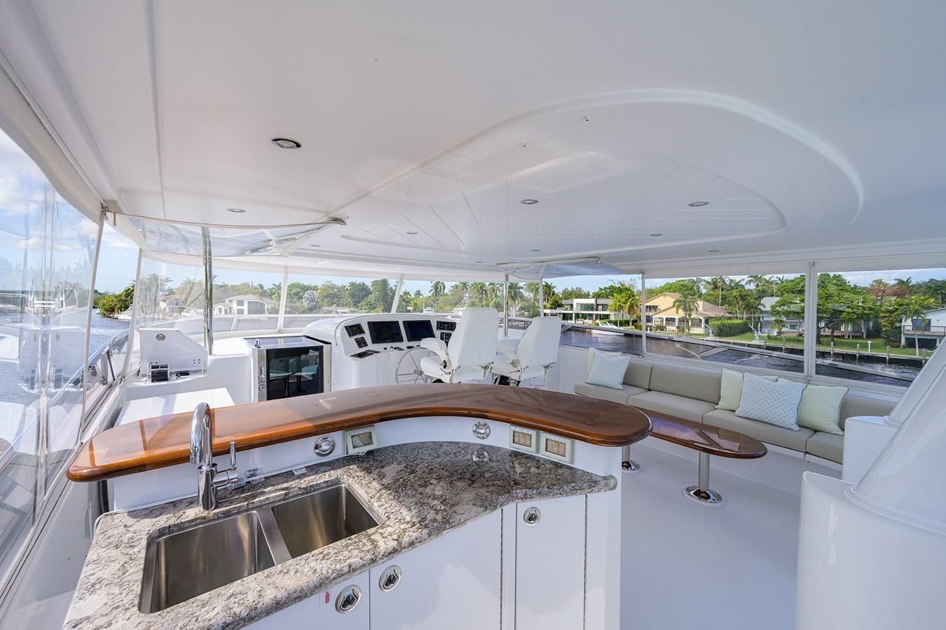 a large white and wood kitchen aboard TIRELESS Yacht for Sale