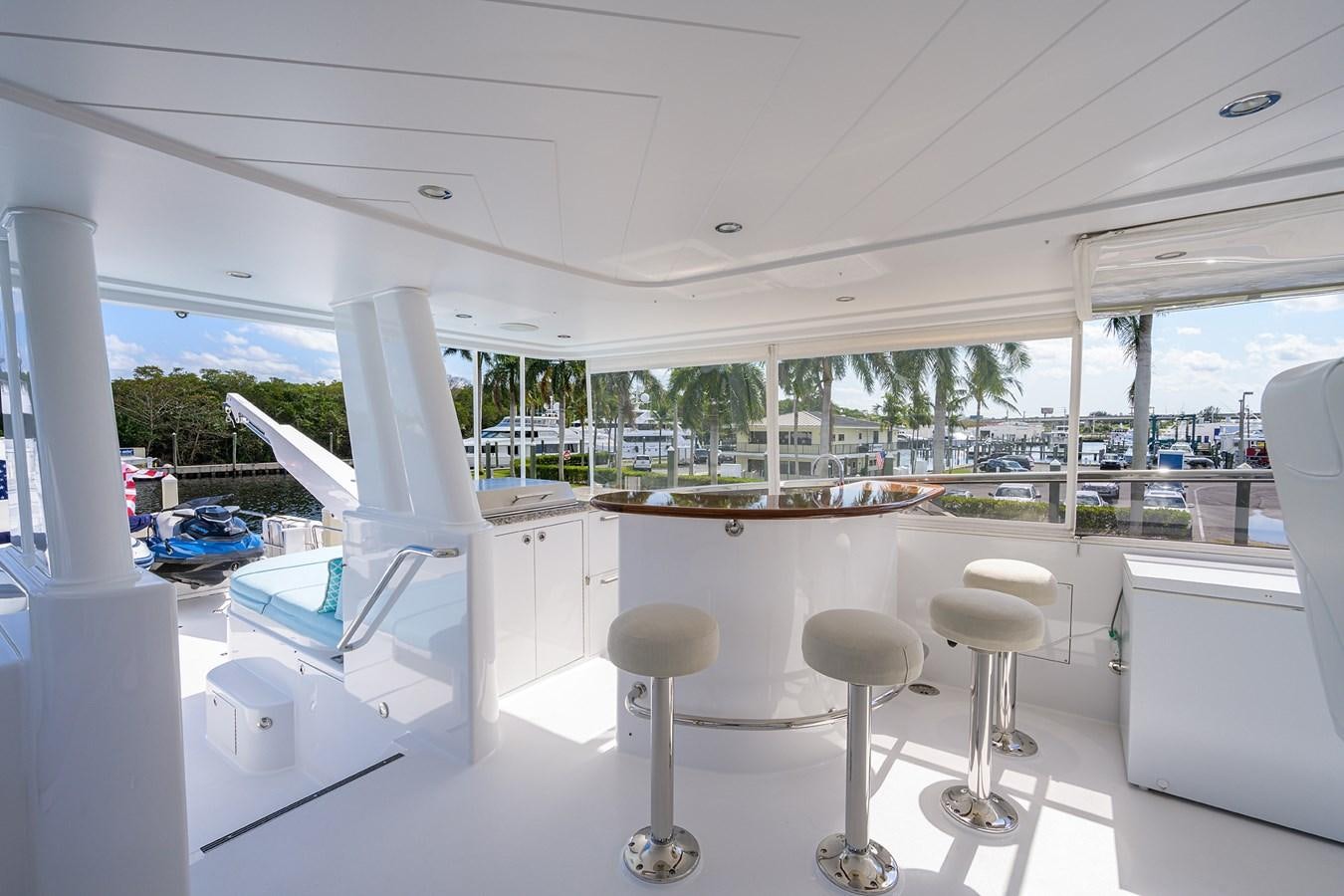 a room with a couple of chairs and a table with chairs aboard TIRELESS Yacht for Sale