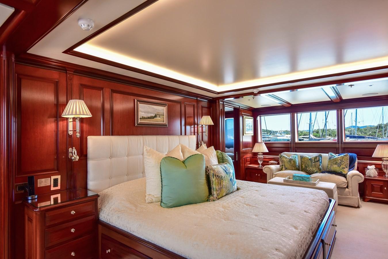 a bedroom with a bed and a couch aboard BERILDA Yacht for Sale