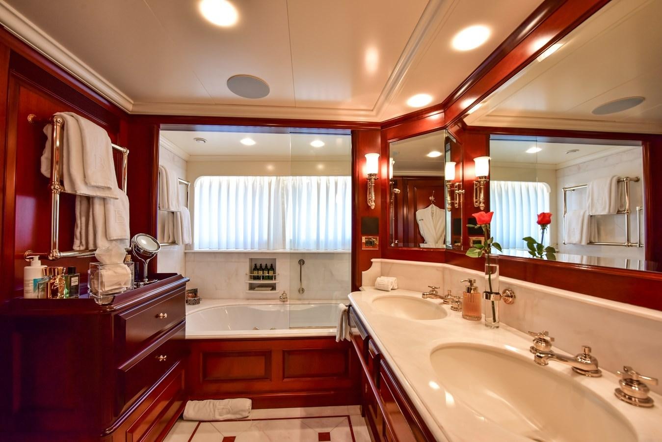 a bathroom with a large mirror aboard BERILDA Yacht for Sale