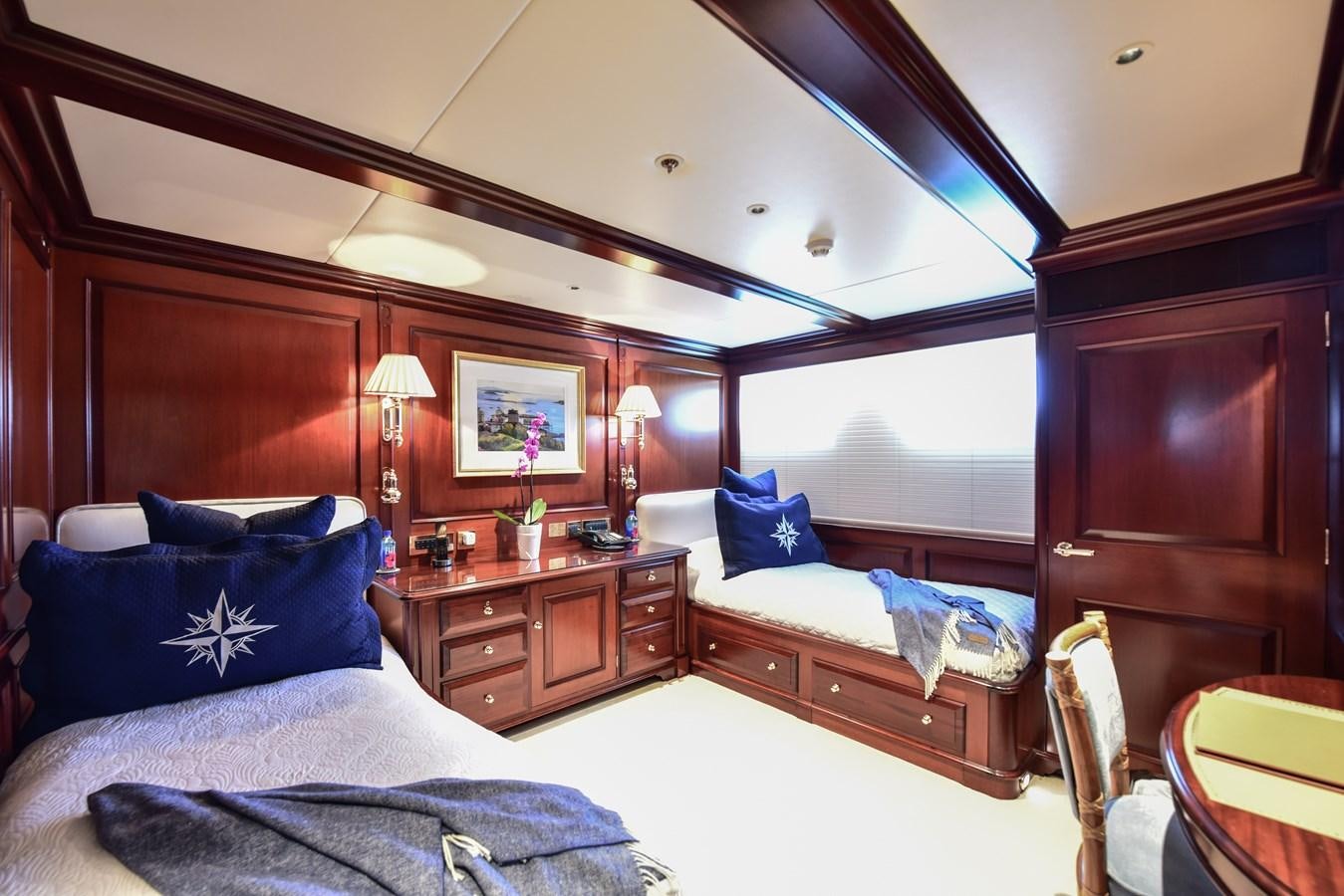a bedroom with a large mirror aboard BERILDA Yacht for Sale