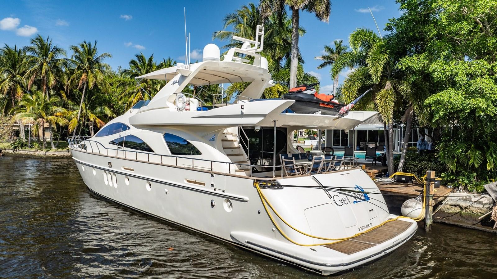a boat docked at a pier aboard GET WET Yacht for Sale