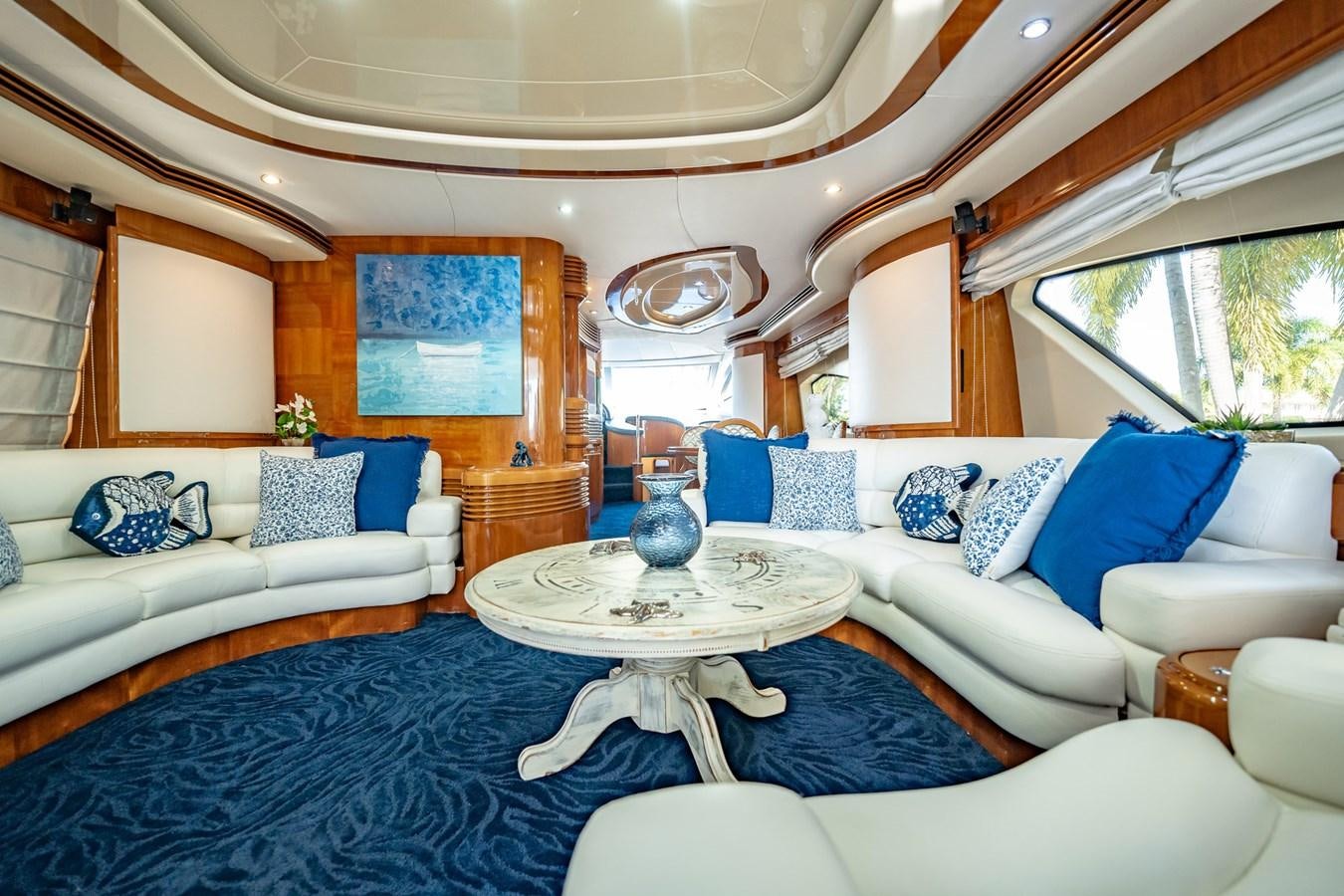 a living room with a blue rug aboard GET WET Yacht for Sale