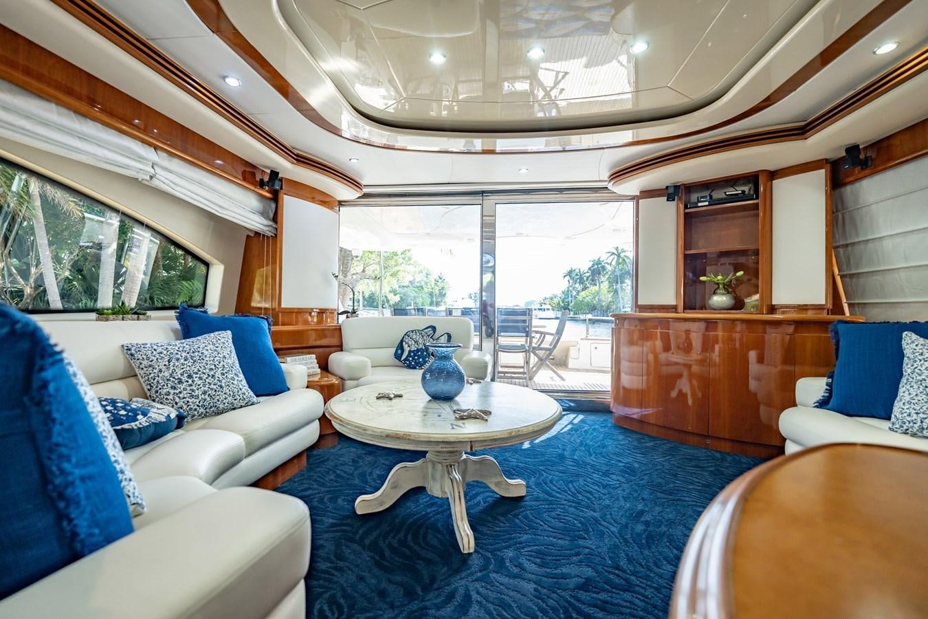 a living room with a blue rug aboard GET WET Yacht for Sale