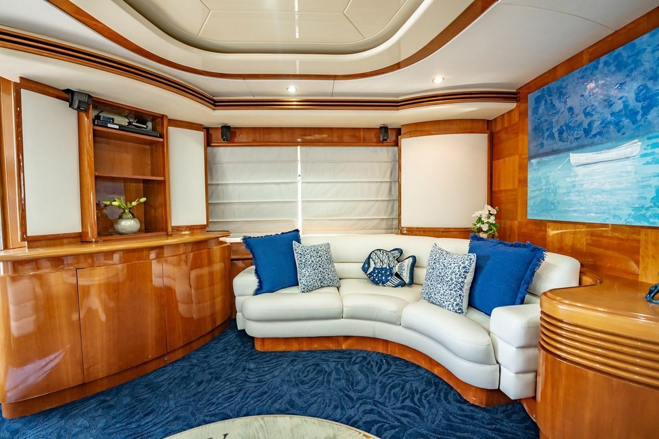 a room with a bed and a blue rug aboard GET WET Yacht for Sale