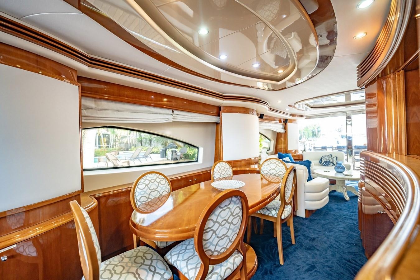 a dining room with a large table aboard GET WET Yacht for Sale