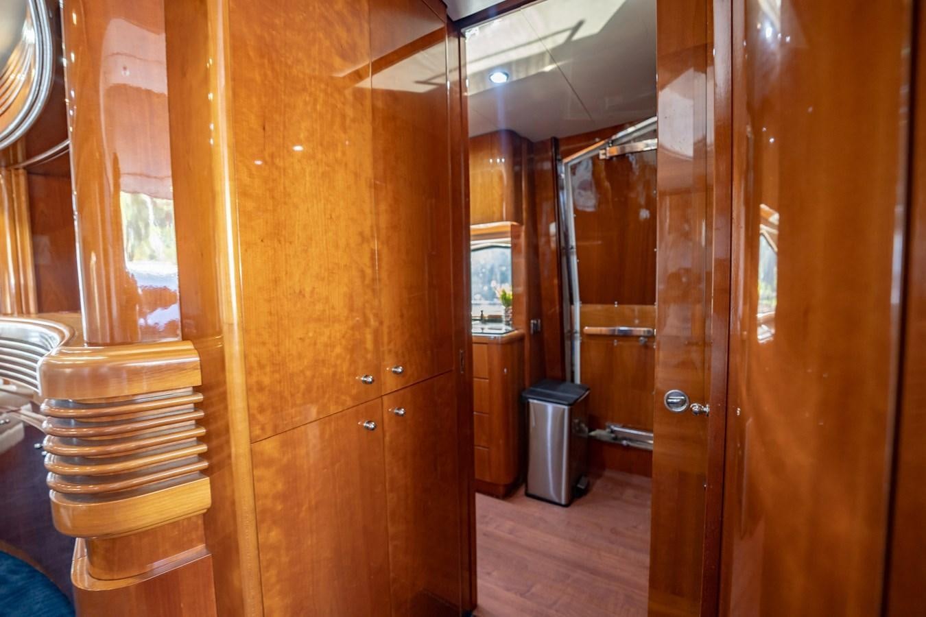 a room with wooden doors aboard GET WET Yacht for Sale