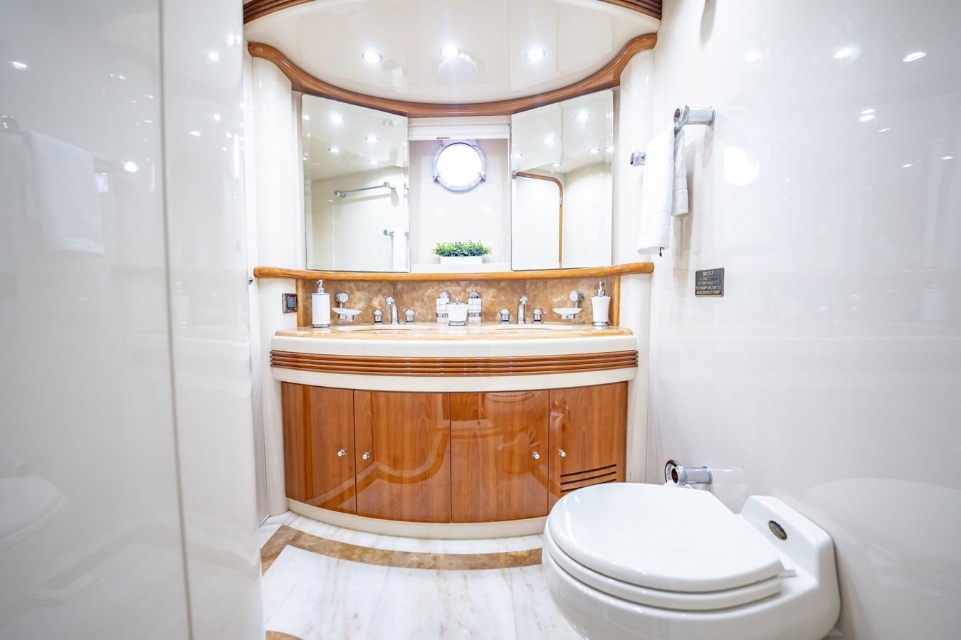 a bathroom with a sink and toilet aboard GET WET Yacht for Sale
