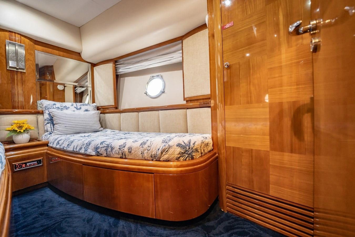 a bed in a room aboard GET WET Yacht for Sale