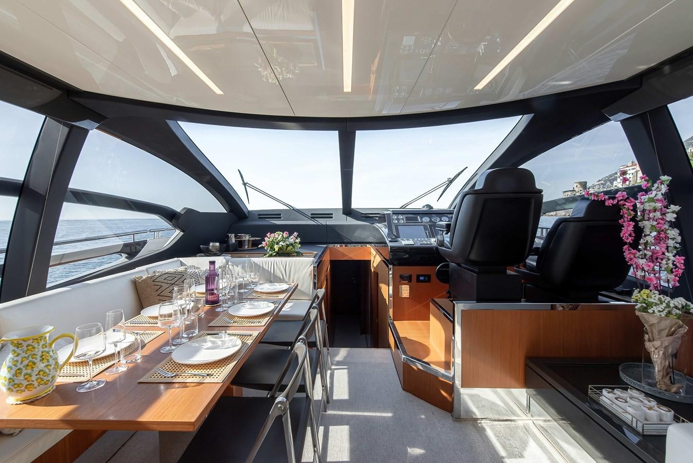 a room with a table and chairs aboard SOUL Yacht for Sale