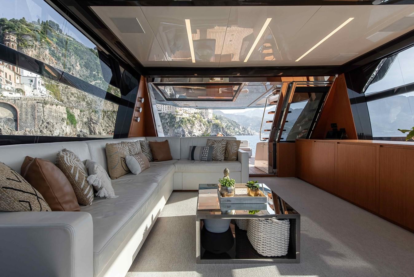 a living room with a couch and a table aboard SOUL Yacht for Sale