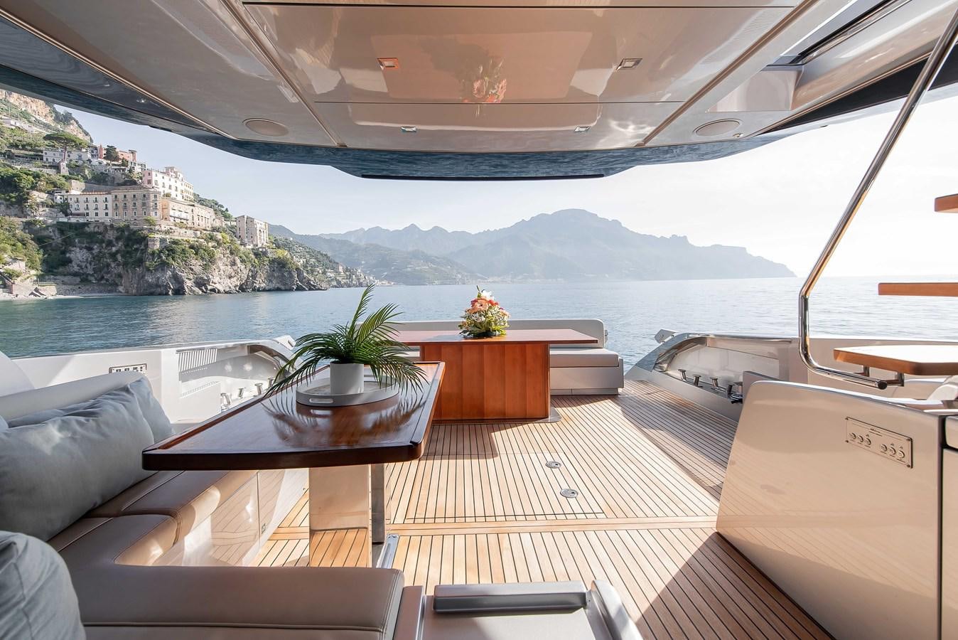 a room with a table and chairs aboard SOUL Yacht for Sale