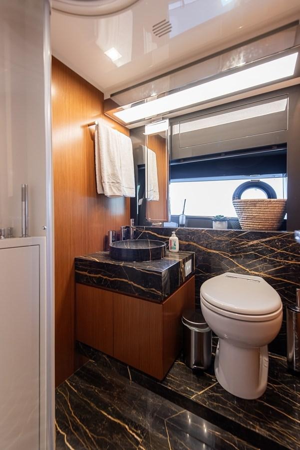 a bathroom with a toilet and a sink aboard SOUL Yacht for Sale