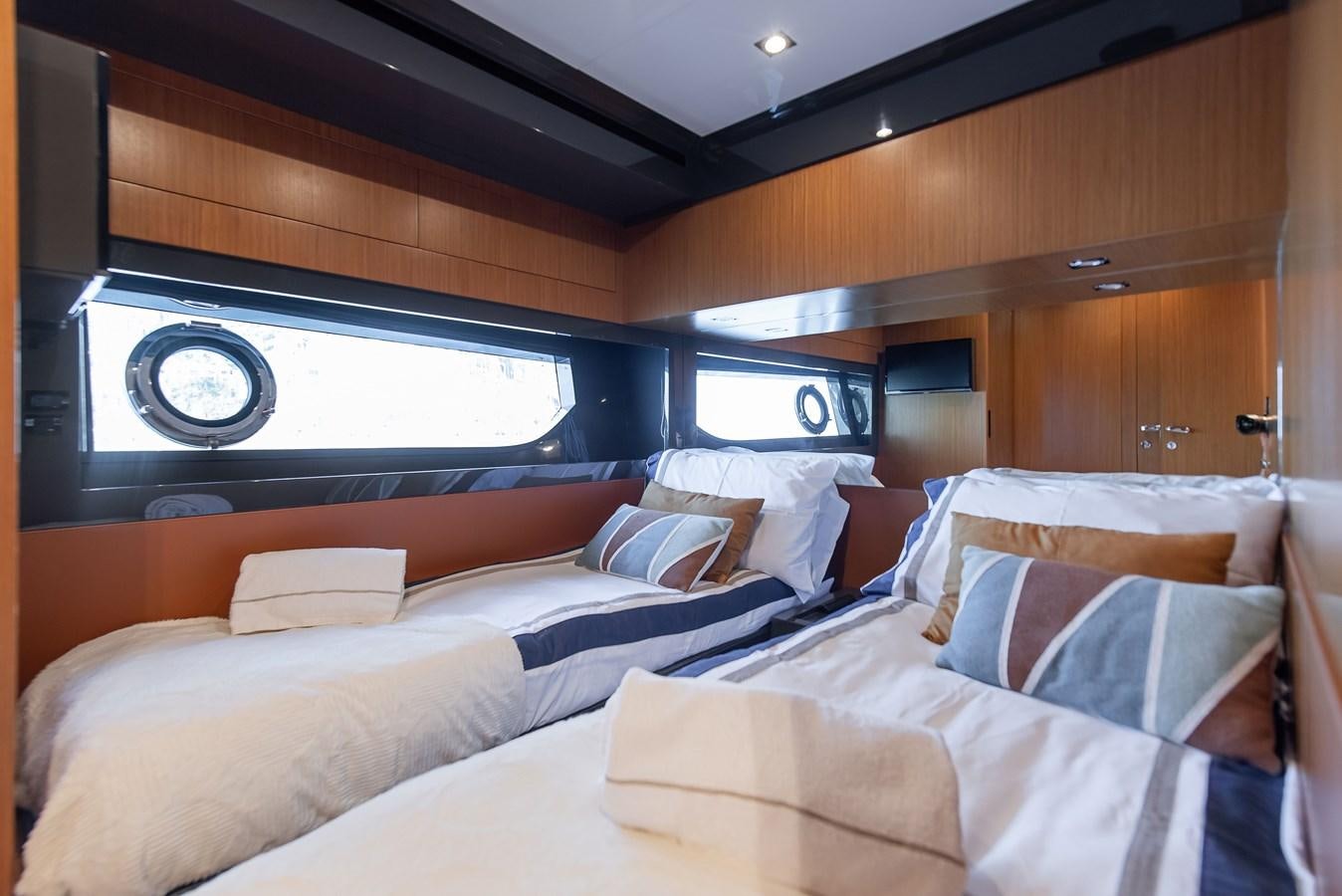 a room with a bed and a large window aboard SOUL Yacht for Sale