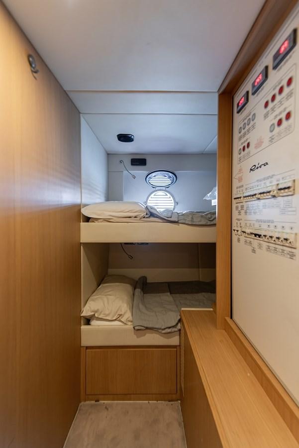 a room with a bed and a fan aboard SOUL Yacht for Sale