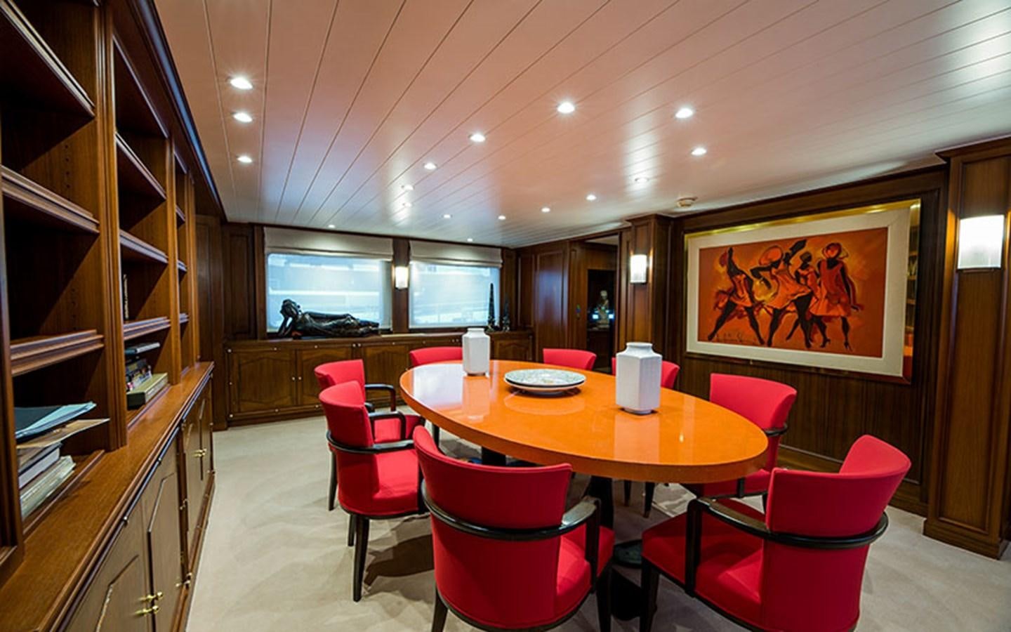 a room with a table and chairs aboard NOSTALGIA Yacht for Sale