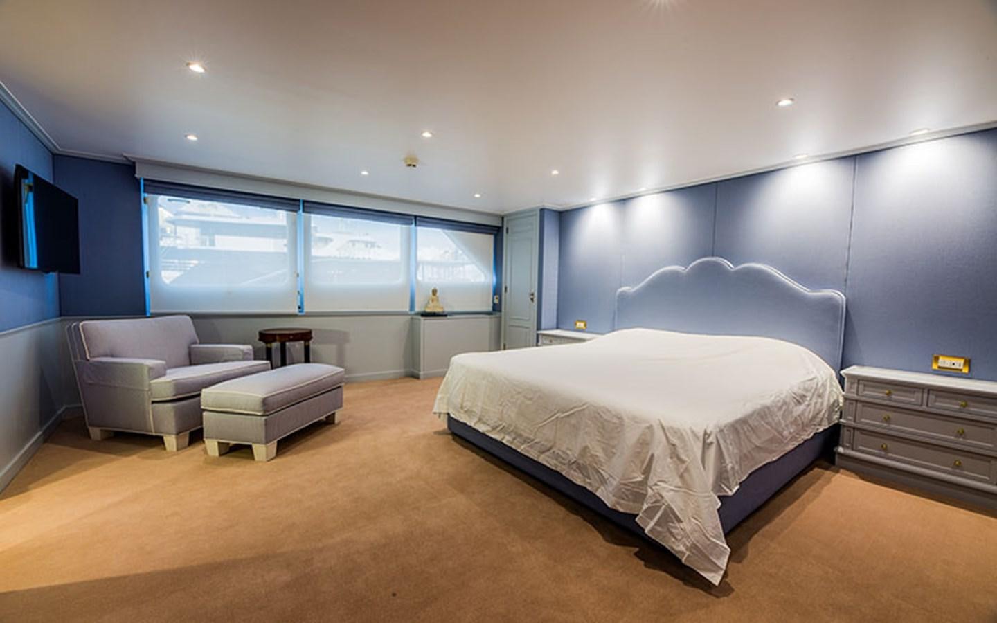 a large bedroom with a bed aboard NOSTALGIA Yacht for Sale