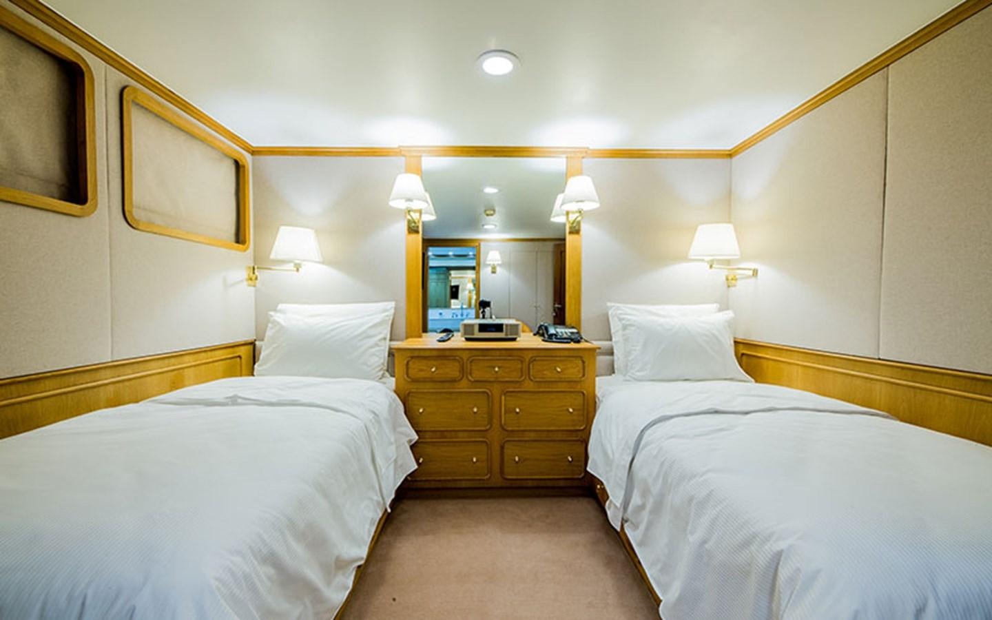 a couple of beds in a hotel room aboard NOSTALGIA Yacht for Sale