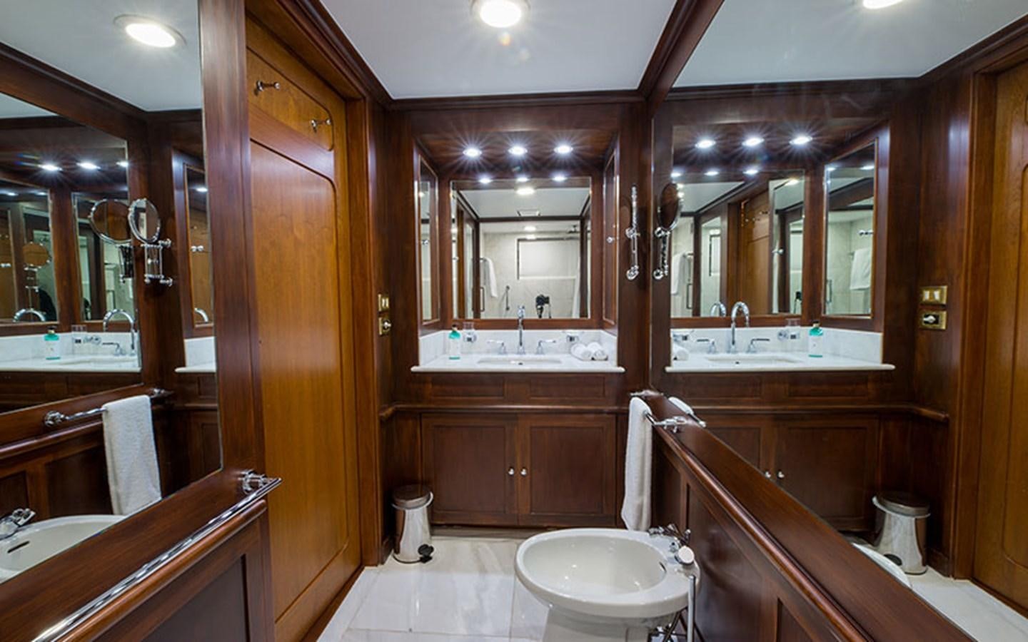 a bathroom with a large mirror aboard NOSTALGIA Yacht for Sale
