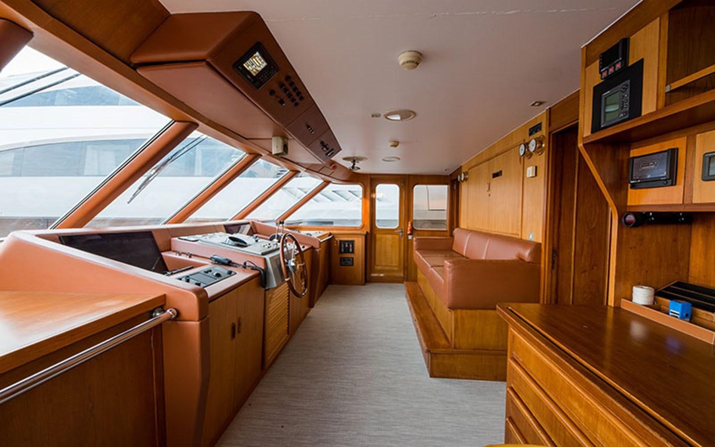 a room with a couch and a table aboard NOSTALGIA Yacht for Sale