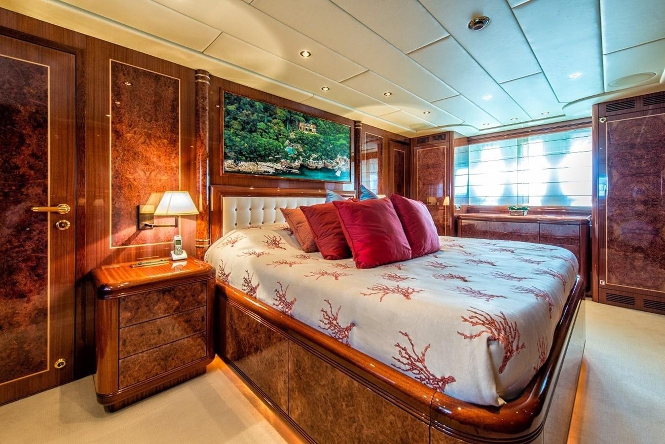 a bedroom with a large bed aboard PHANTOM Yacht for Sale
