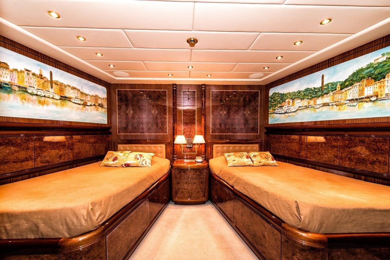 a room with two beds aboard PHANTOM Yacht for Sale