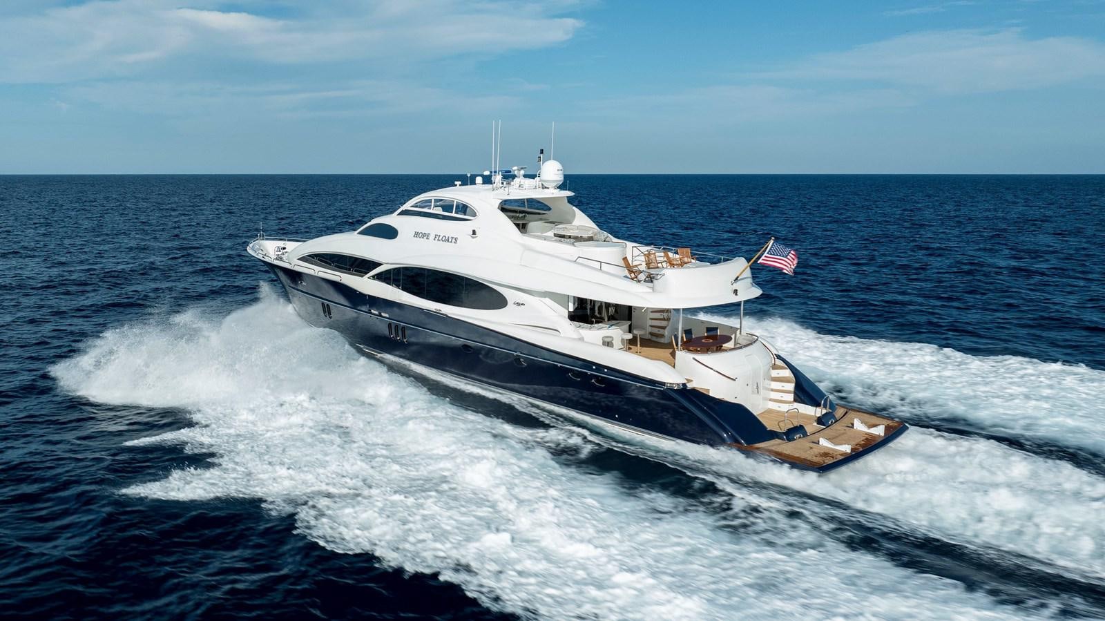 a boat on the water aboard LAZZARA 116 OPEN BRIDGE Yacht for Sale