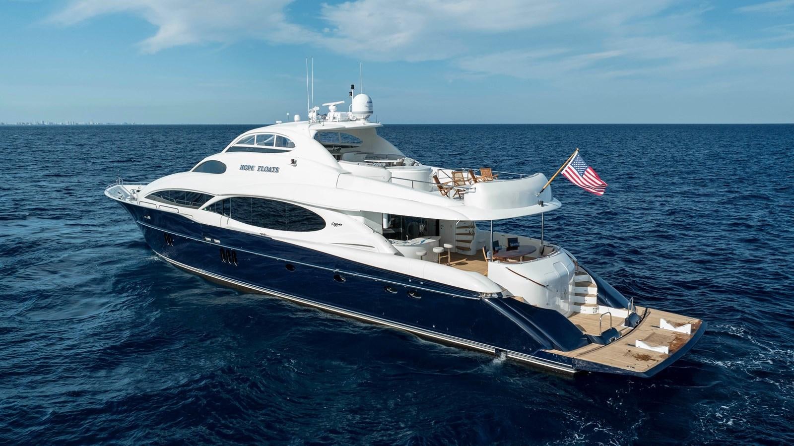 a white yacht on the water aboard LAZZARA 116 OPEN BRIDGE Yacht for Sale