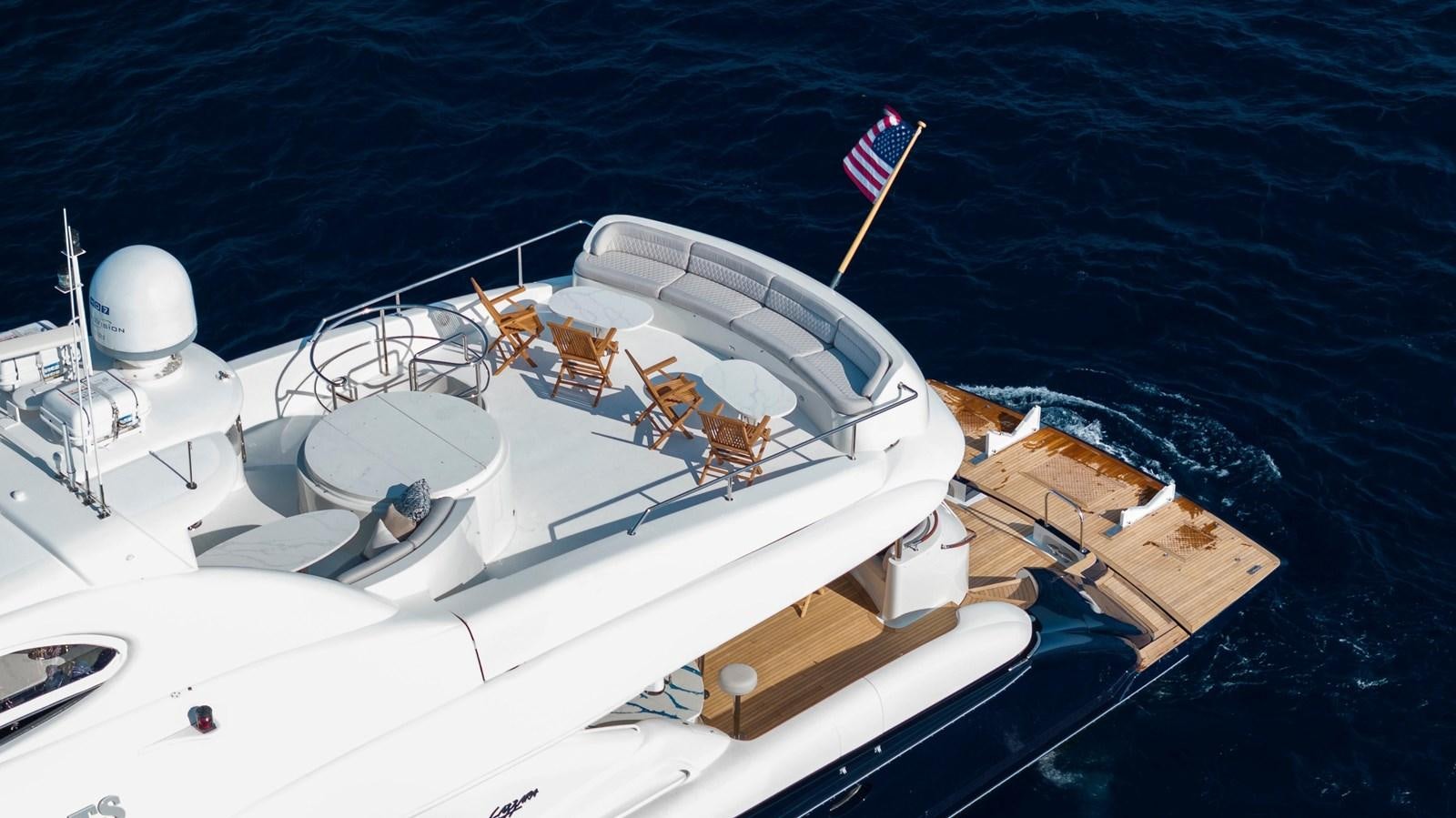 a ship with a flag on the deck aboard LAZZARA 116 OPEN BRIDGE Yacht for Sale