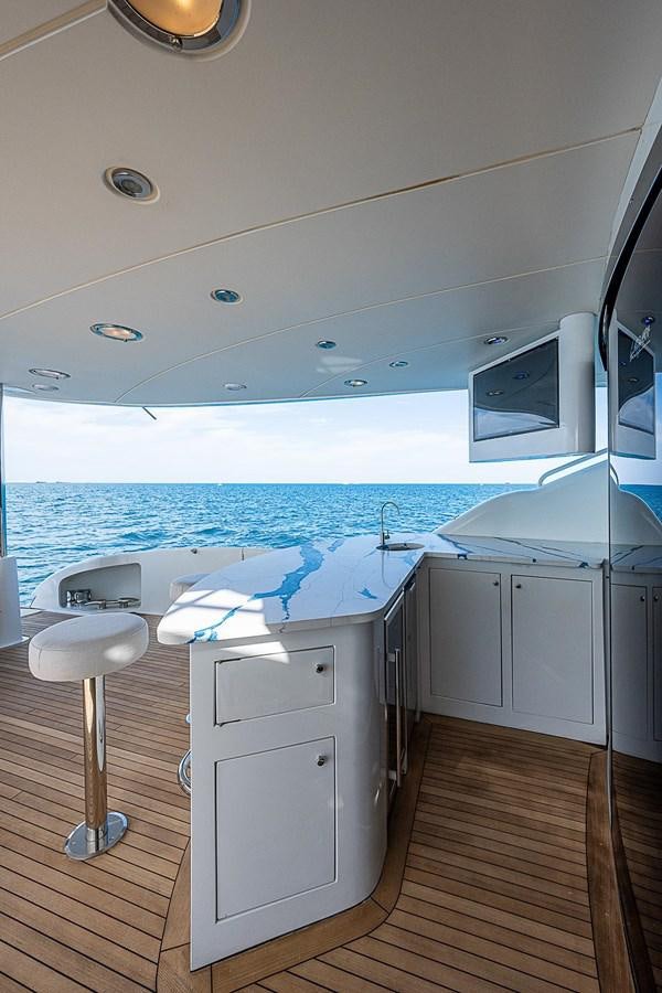 a room with a large window and a view of the ocean aboard LAZZARA 116 OPEN BRIDGE Yacht for Sale