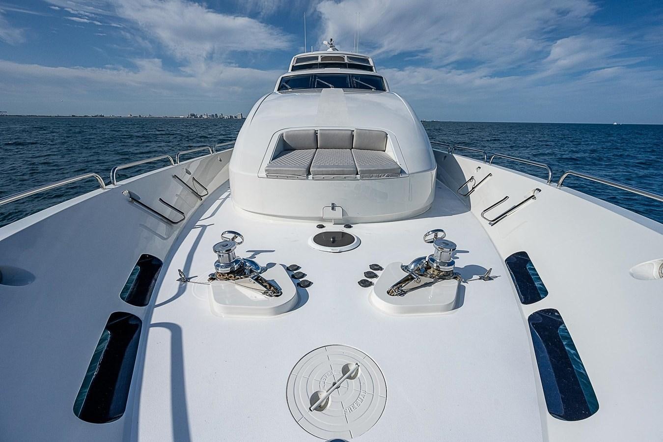 a white boat on a body of water aboard LAZZARA 116 OPEN BRIDGE Yacht for Sale