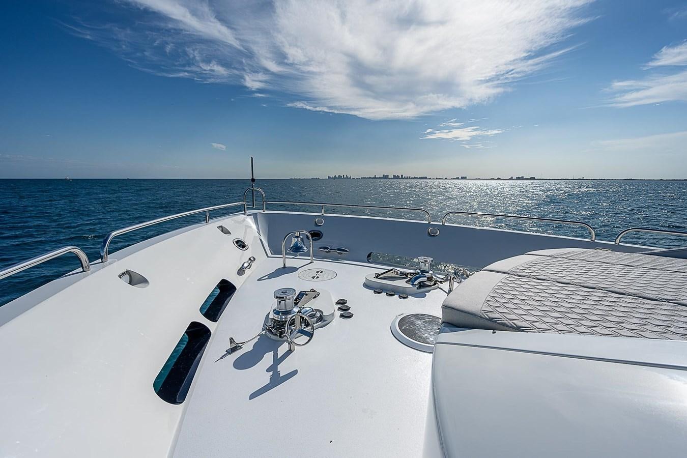 a boat with a person on it aboard LAZZARA 116 OPEN BRIDGE Yacht for Sale