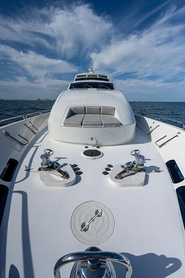 a white boat with a steering wheel aboard LAZZARA 116 OPEN BRIDGE Yacht for Sale