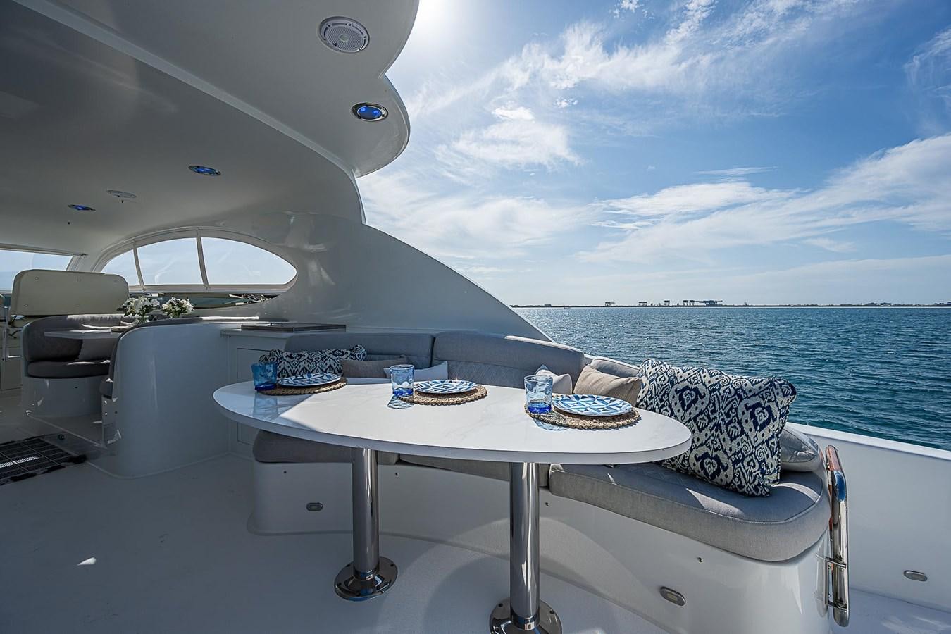 a table on a boat aboard LAZZARA 116 OPEN BRIDGE Yacht for Sale
