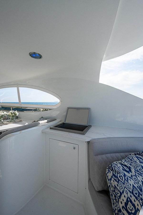a small white room with a laptop on a desk aboard LAZZARA 116 OPEN BRIDGE Yacht for Sale