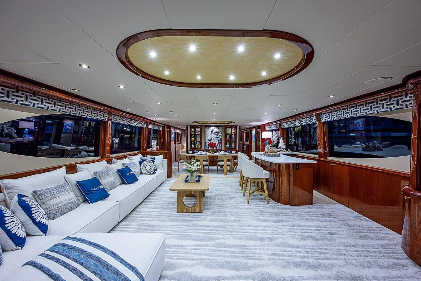 a room with a bed and a table aboard LAZZARA 116 OPEN BRIDGE Yacht for Sale