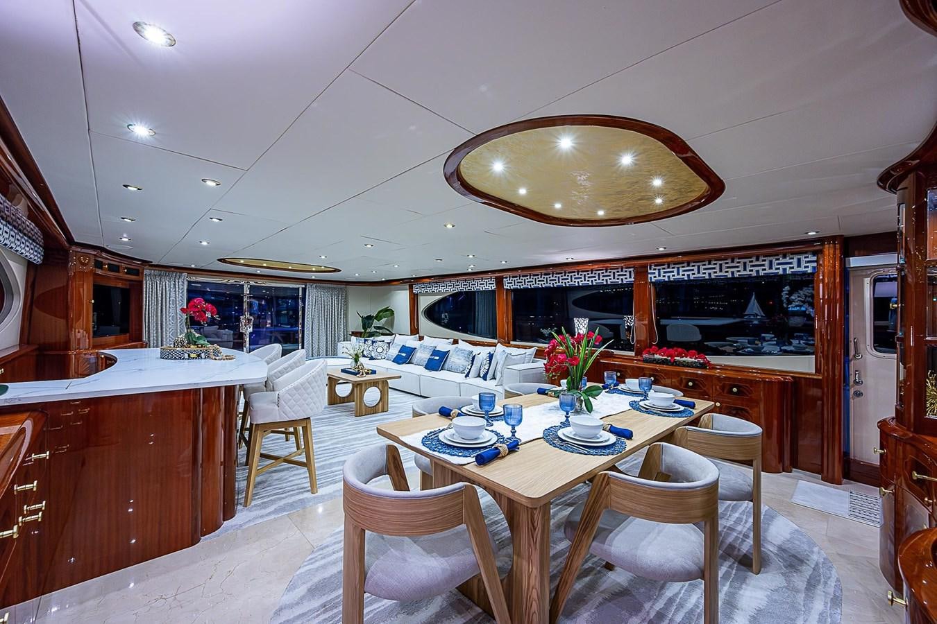 a dining room with a table and chairs aboard LAZZARA 116 OPEN BRIDGE Yacht for Sale