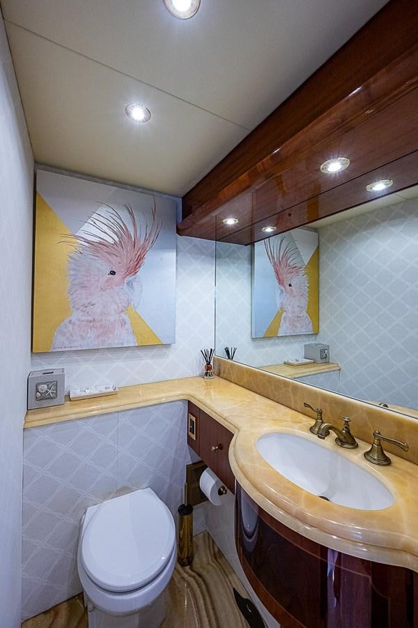 a bathroom with a toilet and a sink aboard LAZZARA 116 OPEN BRIDGE Yacht for Sale