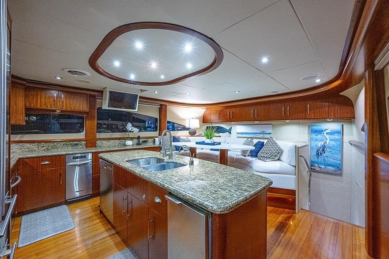 a large kitchen with a large island aboard LAZZARA 116 OPEN BRIDGE Yacht for Sale
