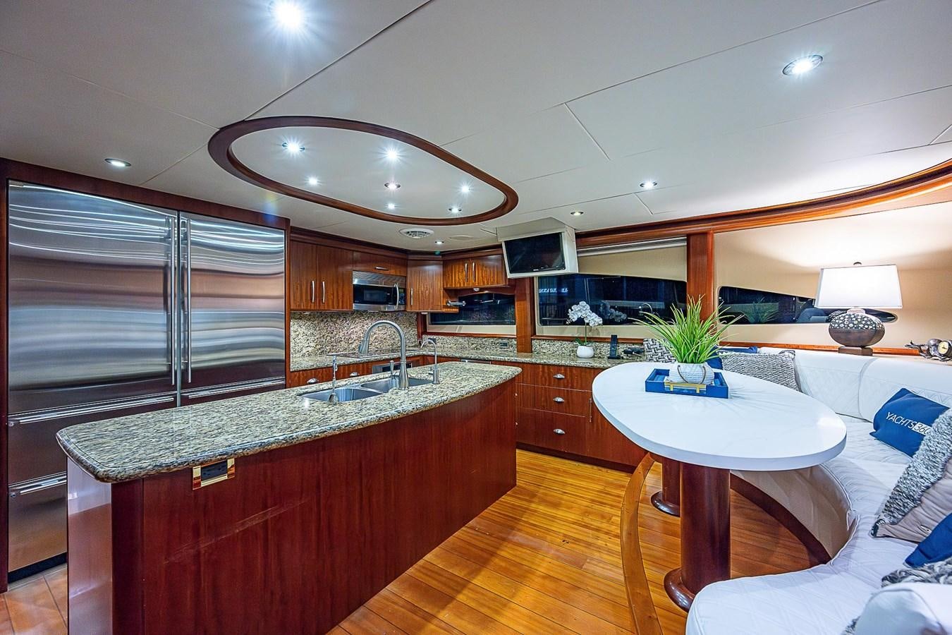 a kitchen with a large island aboard LAZZARA 116 OPEN BRIDGE Yacht for Sale