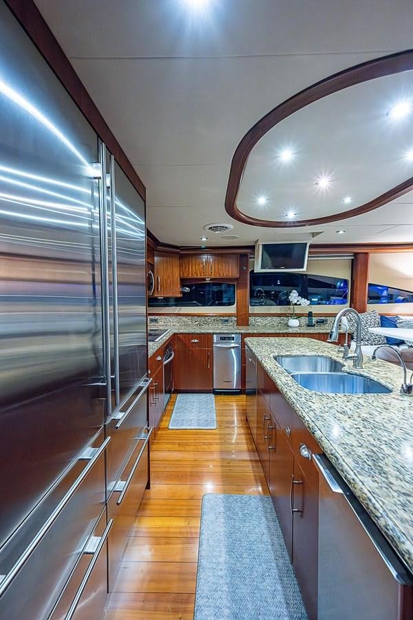 a kitchen with a large glass shower aboard LAZZARA 116 OPEN BRIDGE Yacht for Sale