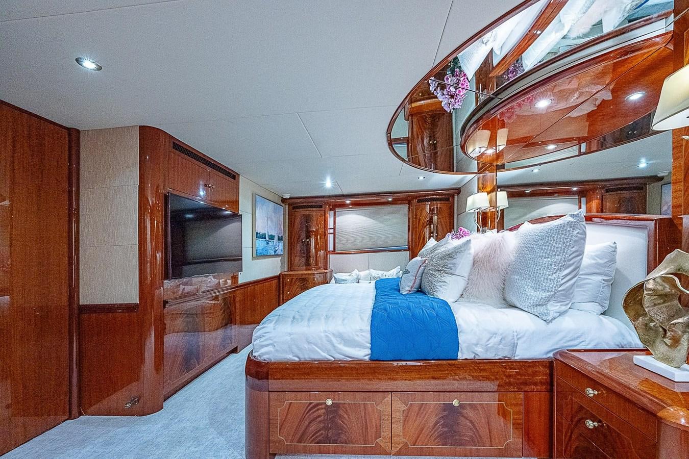 a bed in a room aboard LAZZARA 116 OPEN BRIDGE Yacht for Sale