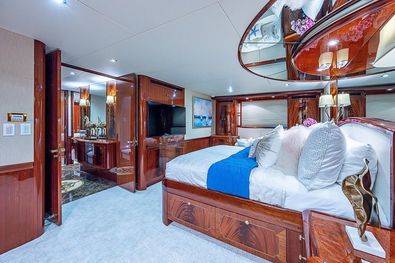 a bedroom with a large bed aboard LAZZARA 116 OPEN BRIDGE Yacht for Sale